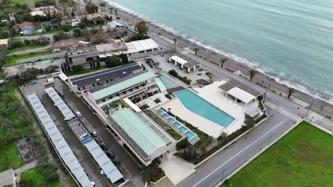 Aerial view of a beachfront hotel with a pool in Kalamata Greece Video stock 303034214