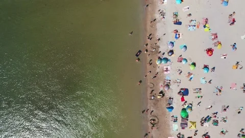 Aerial view of the beachfront in the middle of a hot summer day. Stock Footage 159013143