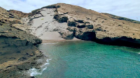Aerial view of a beautiful and lonely hidden cove beach in Tenerife Stock Footage 202201403