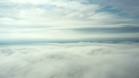 Aerial view of beautiful and soft clouds moving on a blue sky Stock Footage