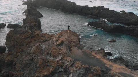 Aerial view. A beautiful bay in the shape of a triangle - the guy stands on a Stockbeeldmateriaal 112095918
