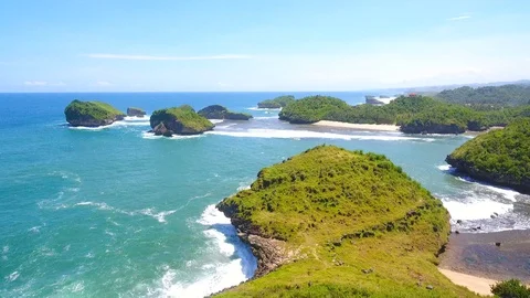 Aerial View of Beautiful Beach with small green islands Stock Footage 128706333