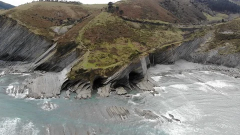 Aerial view of beautiful cliffs and caves in Basque Country, northern Spain. Video stock 90979861
