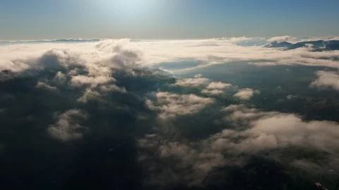 An Aerial View of Beautiful Clouds Over a Scenic Landscape Below Stock Footage 320061305