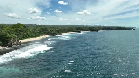 Aerial view of beautiful empty tropical beach in Yogyakarta, Indonesia. Stock Footage 231383960