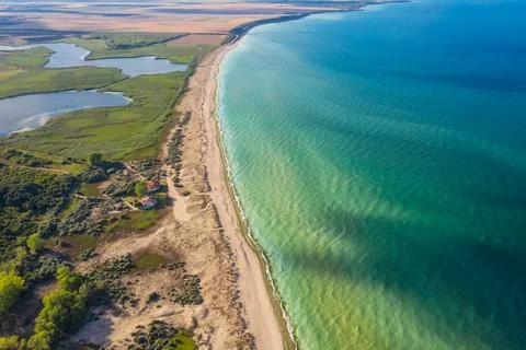Aerial view of beautiful empty wild beach with turquoise sea waters and lake. 스톡 사진