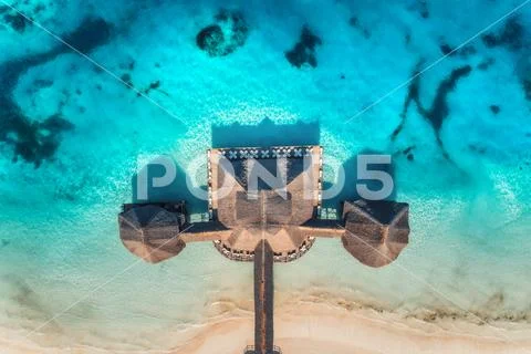 Aerial view of beautiful hotel in Indian ocean at sunrise Stock Photos