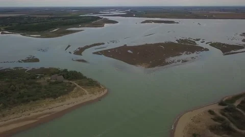 Aerial view of the beautiful lagoon of Caorle in Venice in Italy with people Stock Footage 139528311