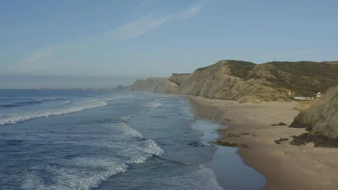 Aerial View Of Beautiful Large Sandy Beach And Rocky Shore Stock Footage 128844592