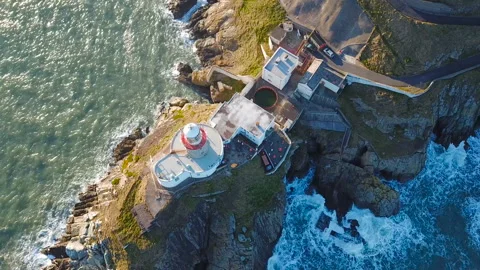 Aerial view of beautiful lighthouse on a cliff in Howth, Ireland Stock Footage 87618924