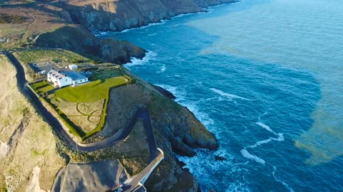 Aerial view of beautiful lighthouse on a cliff in Howth, Ireland Видео 87739971