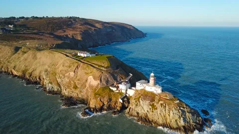 Aerial view of beautiful lighthouse on a cliff in Howth, Ireland Video stock 87765955