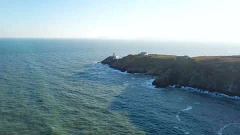 Aerial view of beautiful lighthouse on a cliff in Howth, Ireland Video stock 87781500