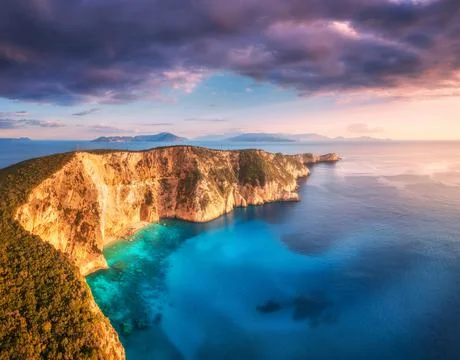 Aerial view of beautiful mountain, blue sea at sunset in summer Stock Photos