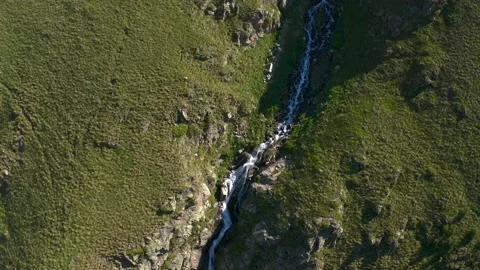 Aerial view of a beautiful mountain stream forming a mountain waterfall Video stock 135642832