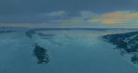 Aerial view, beautiful patterns on white ice from frost on a wide river. Blue Stock Footage 195970870