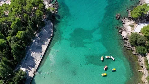 Aerial view of Beautiful remote Beach with green waters Stock Footage 287546795