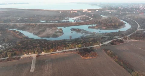 Aerial view of beautiful river, clouds and land. Autumn sunrise mood scenario Stock Footage 198355199