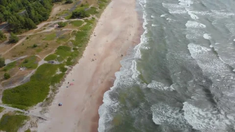 Aerial view of a beautiful sandy beach and Baltic sea waves in Lithuania Stock Footage 321753014
