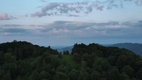 Aerial view of beautiful summer mountain range with colorful clouds Stock Footage 245848372