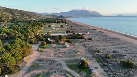 Aerial view of a beautiful sunset at Elea Beach, Greece, a popular camping spot Stock-Footage 303300549