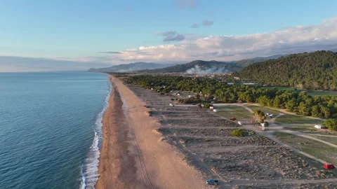 Aerial view of a beautiful sunset at Elea Beach, Greece, a popular camping spot 스톡 동영상 303301862