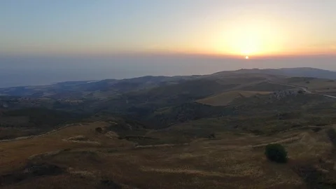 Aerial view of beautiful sunset over meadows and mountains Stock Footage 87982205