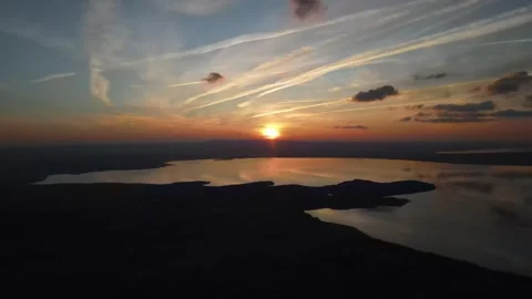 Aerial view of a beautiful sunset over a scenic lake Stock Footage 338007791