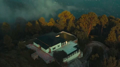 Aerial view of beautiful villa in the mountains surrounded by trees in Pakistan Stock Footage 168988053