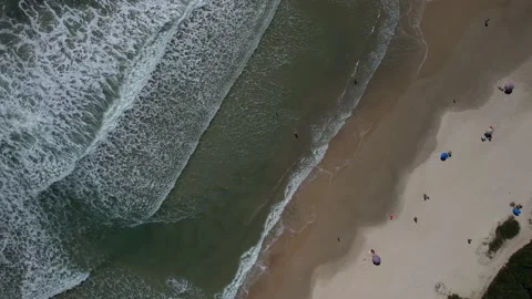 Aerial view of beautiful waves reaching the beach Stock Footage 229851788