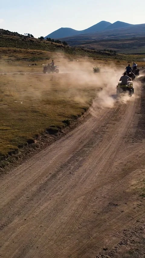 Aerial View Behind Atvs By Lake Mountain Vertical Video Stock Footage 334872123