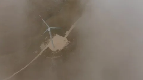 Aerial view behind clouds giant turbines electric generators Video stock 117575929
