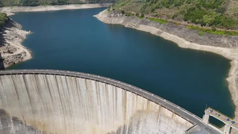Aerial view of Belesar hydroelectric dam showing low water levels Stock Footage 345146156
