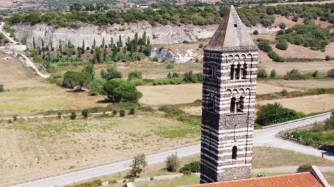 Aerial view of bell tower of the Basilica of the Holy Trinity, Saccargia Stock Footage 308947697