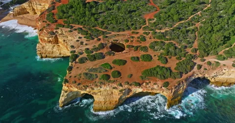Aerial view of Benagil Cave, viewed through the circular cliff-top hole Algarve Stock Footage 310201669