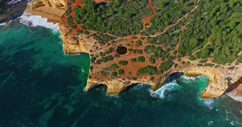 Aerial view of Benagil Cave, viewed through the circular cliff-top hole Algarve 库存影片 312271677