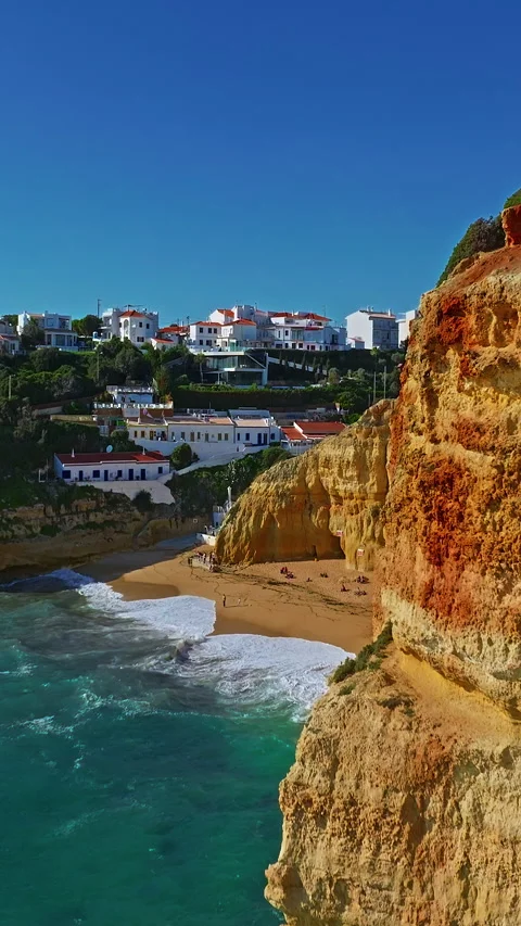 Aerial view of Benagil Cave, viewed through the circular cliff-top hole Algarve Stock Footage 318597300