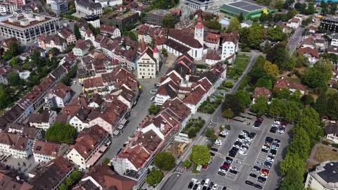 Aerial view beside the old town and castle  above the city Sursee Vídeo Stock 343921353