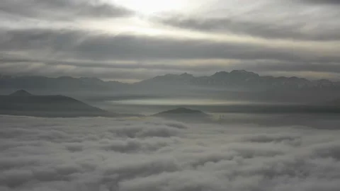 An aerial view between a sea of clouds where Stock Footage 157457086