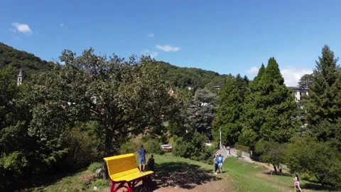 Aerial view of A big bench installed overlooking Lake Como Stock Footage 160165696