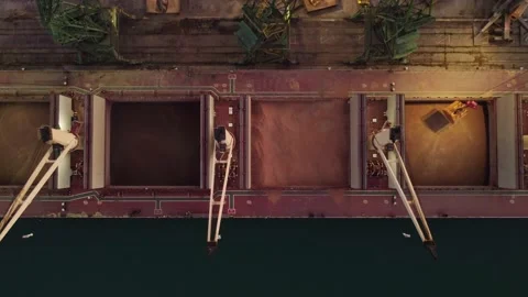 Aerial view of big cargo ship bulk carrier is loaded with grain of wheat in port Stock Footage 197808404