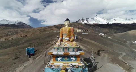 Aerial view of big colourful Buddha statue on mountain. Stock Footage