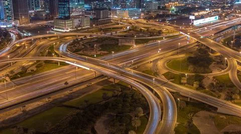 Aerial view on a big highway intersection night timelapse in Dubai Marina and Stock Photos