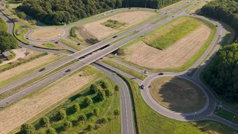 Aerial view of big road intersection with two roundabouts and traffic in Almere Stock Footage 315283968