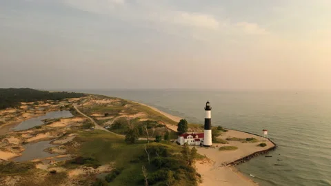 Aerial view of Big Sable Point Lighthouse on the shore of Lake Michigan Stock Footage 157480895