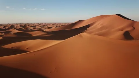 Aerial view on big sand dunes in desert at sunrise Stock Footage