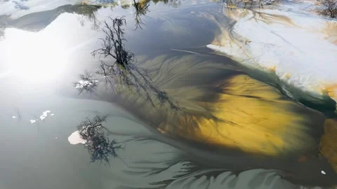 Aerial view of a big waste decanting lake, tailing pond. Mining residual waters Stock Footage 337632565