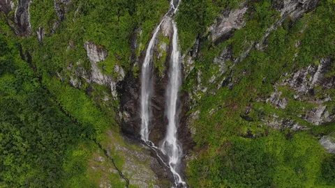 Aerial view big waterfall with two water flows. Parallax over head shot Video stock 111779849