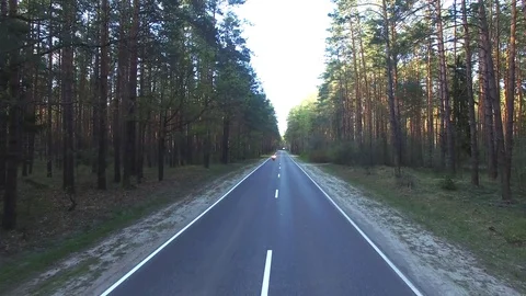 Aerial view of a biker riding a forest road, shot drone Stock Footage 107657059