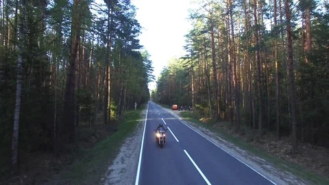 Aerial view of a biker riding a forest road, shot drone Stock-Footage 107657096